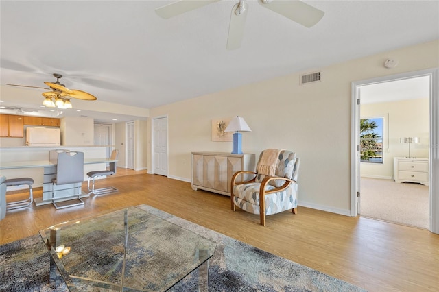 601 Shreve St Unit 21C, Punta Gorda, FL 33950 - living room featuring ceiling fan, light wood-type flooring, and baseboards