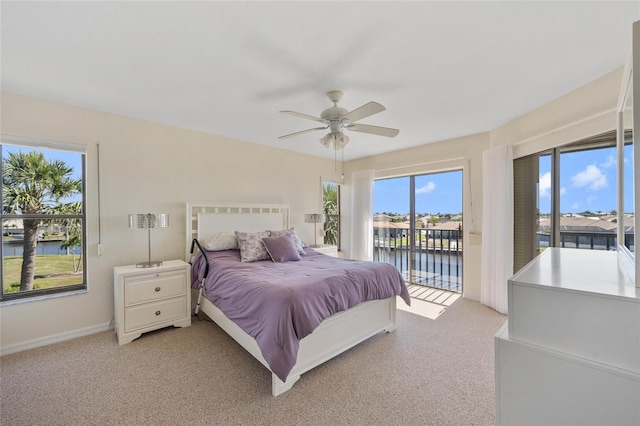 601 Shreve St Unit 21C, Punta Gorda, FL 33950 - bedroom with a water view, access to outside, and light colored carpet
