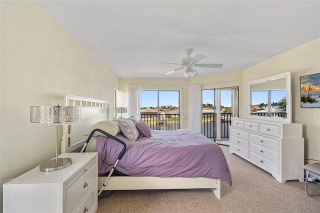601 Shreve St Unit 21C, Punta Gorda, FL 33950 - bedroom with access to exterior, light colored carpet, a water view, and a ceiling fan
