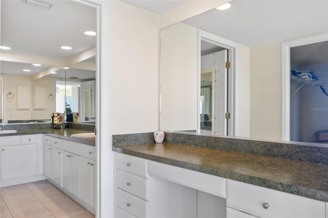 601 Shreve St Unit 21C, Punta Gorda, FL 33950 - bathroom featuring vanity, tile patterned floors, recessed lighting, and a spacious closet