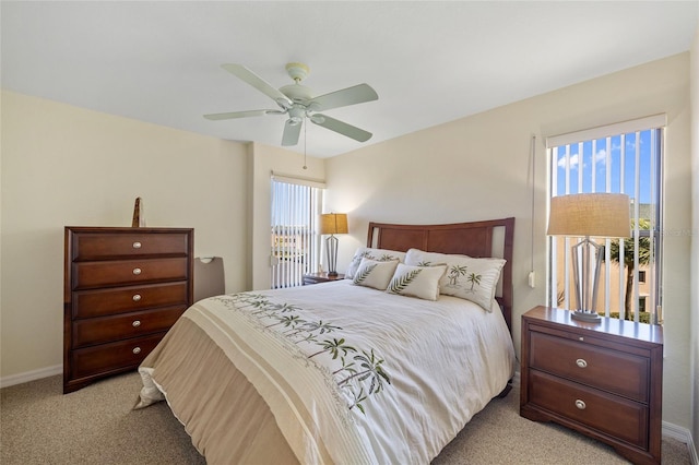 601 Shreve St Unit 21C, Punta Gorda, FL 33950 - bedroom with light colored carpet, baseboards, and a ceiling fan