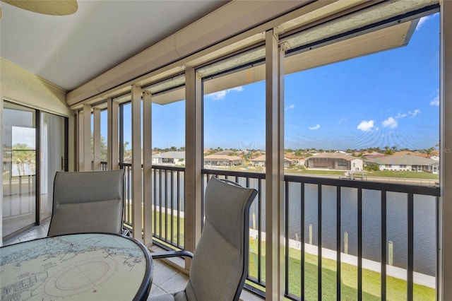 601 Shreve St Unit 21C, Punta Gorda, FL 33950 - sunroom / solarium featuring a water view, a residential view, and tile patterned floors