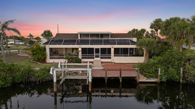 4317 Mccullough St, Port Charlotte, FL 33948 - back of house featuring a balcony, a water view, a sunroom, and boat lift