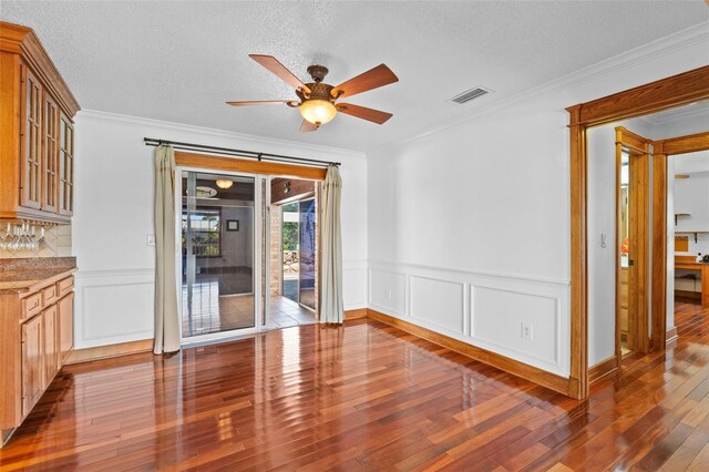 4317 Mccullough St, Port Charlotte, FL 33948 - spare room featuring hardwood / wood-style floors, a ceiling fan, crown molding, wainscoting, and a textured ceiling