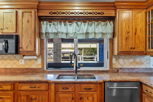 4317 Mccullough St, Port Charlotte, FL 33948 - kitchen with black microwave, a sink, stainless steel dishwasher, backsplash, and brown cabinets