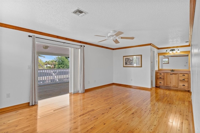 4317 Mccullough St, Port Charlotte, FL 33948 - unfurnished room featuring light wood-style flooring, plenty of natural light, crown molding, ceiling fan, and a textured ceiling