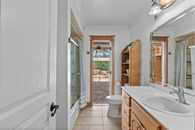 4317 Mccullough St, Port Charlotte, FL 33948 - bathroom with toilet, vanity, tile patterned floors, ornamental molding, and combined bath / shower with glass door