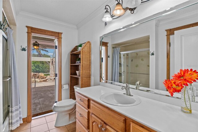 4317 Mccullough St, Port Charlotte, FL 33948 - bathroom featuring vanity, tile patterned flooring, toilet, ornamental molding, and a shower with door