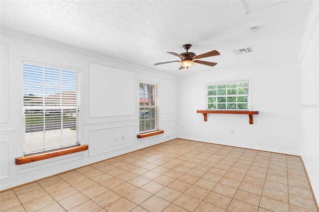 4317 Mccullough St, Port Charlotte, FL 33948 - spare room featuring crown molding, a textured ceiling, a ceiling fan, and light tile patterned floors