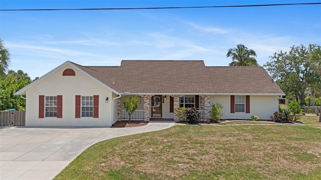 4317 Mccullough St, Port Charlotte, FL 33948 - view of front facade featuring stucco siding, covered porch, and roof with shingles