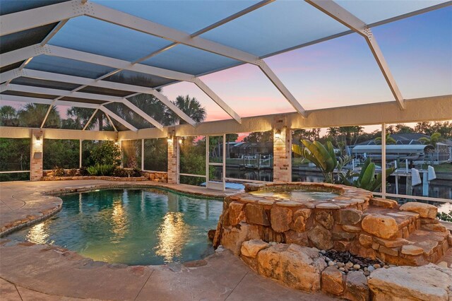 4317 Mccullough St, Port Charlotte, FL 33948 - view of pool featuring glass enclosure, a patio, boat lift, a pool with connected hot tub, and a boat dock