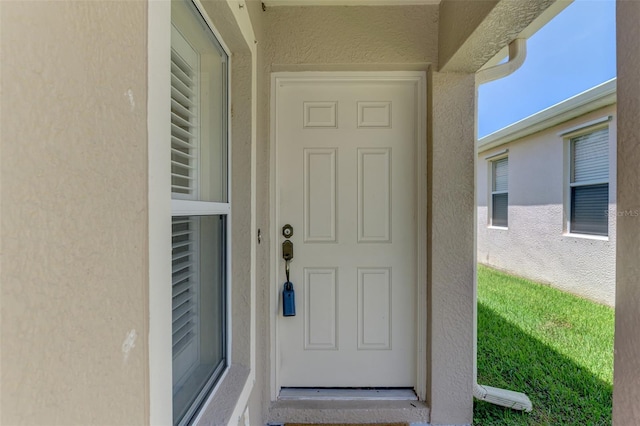 13210 SW Pembroke Cir N, Lake Suzy, FL 34269 - entrance to property featuring stucco siding