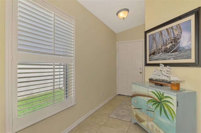 13210 SW Pembroke Cir N, Lake Suzy, FL 34269 - entrance foyer with light tile patterned flooring, lofted ceiling, and baseboards