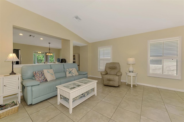 13210 SW Pembroke Cir N, Lake Suzy, FL 34269 - living room with lofted ceiling, light tile patterned floors, baseboards, a chandelier, and recessed lighting