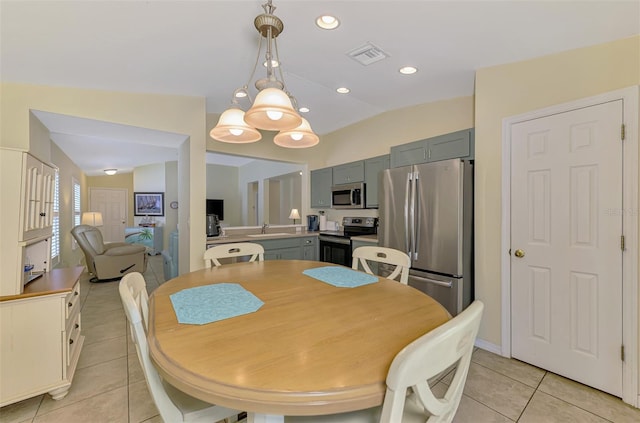 13210 SW Pembroke Cir N, Lake Suzy, FL 34269 - dining area featuring light tile patterned floors and vaulted ceiling