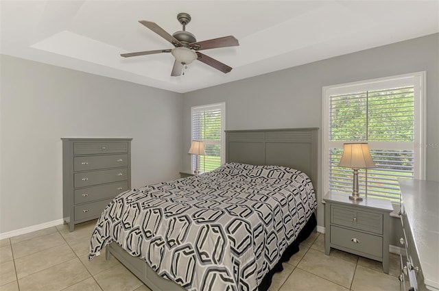 13210 SW Pembroke Cir N, Lake Suzy, FL 34269 - bedroom featuring light tile patterned floors, baseboards, and ceiling fan