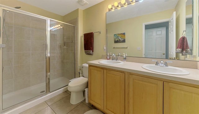 13210 SW Pembroke Cir N, Lake Suzy, FL 34269 - full bathroom featuring tile patterned flooring, toilet, double vanity, and a shower stall