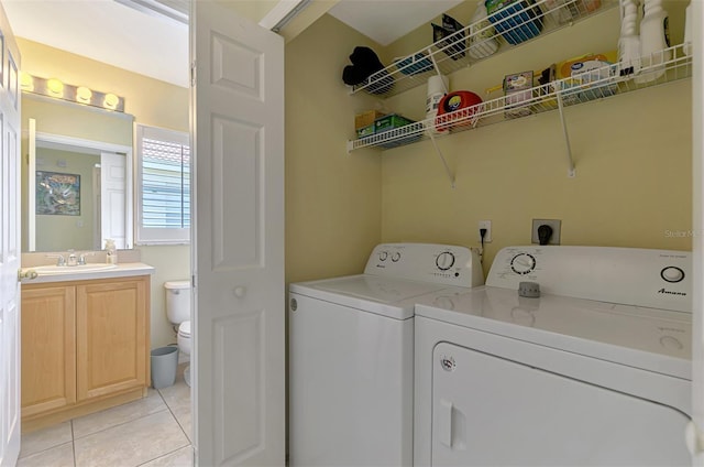 13210 SW Pembroke Cir N, Lake Suzy, FL 34269 - laundry room featuring washer and dryer and light tile patterned floors