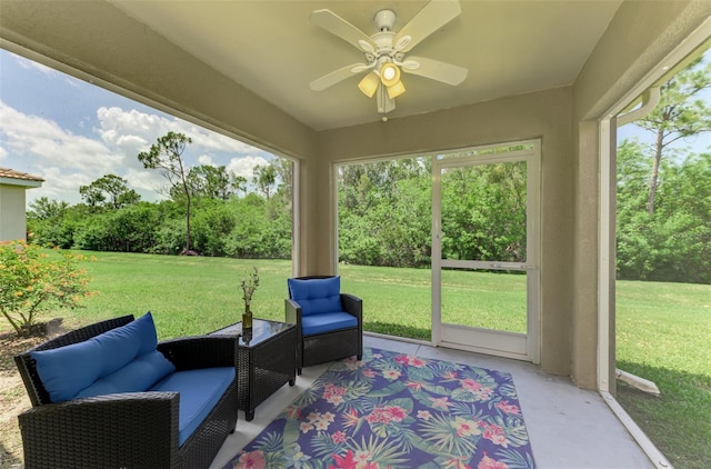 13210 SW Pembroke Cir N, Lake Suzy, FL 34269 - sunroom with ceiling fan, view of wooded area, and an outdoor hangout area