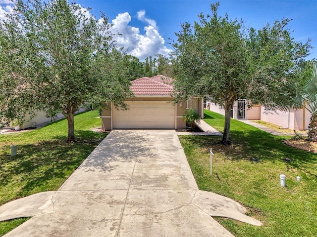 13210 SW Pembroke Cir N, Lake Suzy, FL 34269 - view of front of property featuring a garage, driveway, a front lawn, and stucco siding