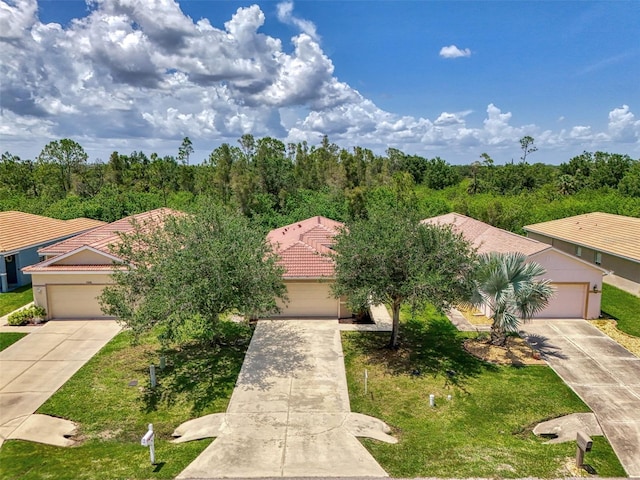 13210 SW Pembroke Cir N, Lake Suzy, FL 34269 - view of front of property with concrete driveway, a tiled roof, and a front lawn