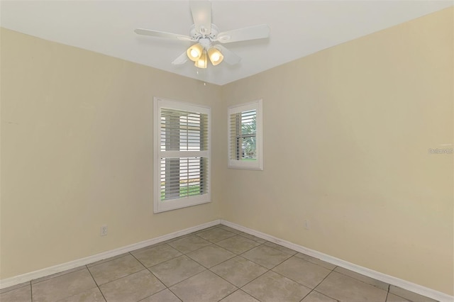 13210 SW Pembroke Cir N, Lake Suzy, FL 34269 - empty room with light tile patterned flooring, baseboards, and ceiling fan