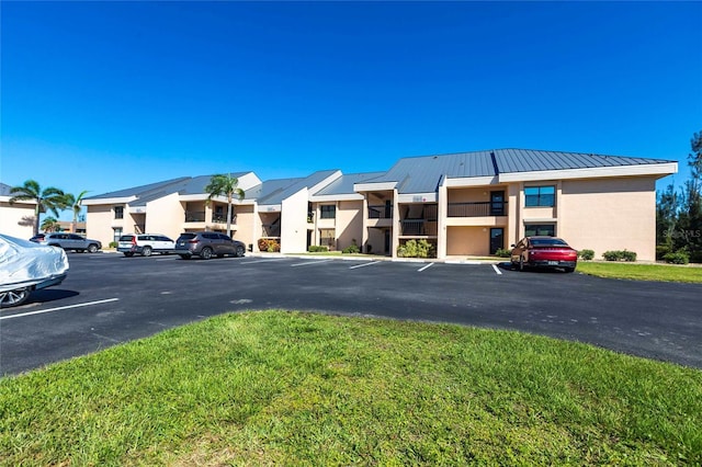 3256 White Ibis Ct Unit 24A, Punta Gorda, FL 33950 - view of property featuring uncovered parking and a residential view