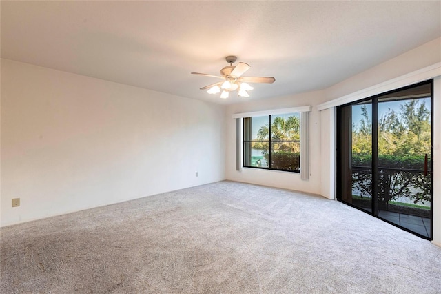 3256 White Ibis Ct Unit 24A, Punta Gorda, FL 33950 - empty room with carpet and a ceiling fan