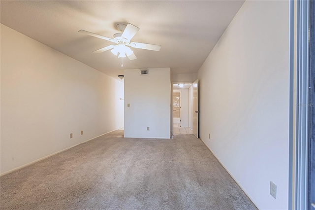 3256 White Ibis Ct Unit 24A, Punta Gorda, FL 33950 - unfurnished bedroom with light colored carpet, ensuite bath, and ceiling fan