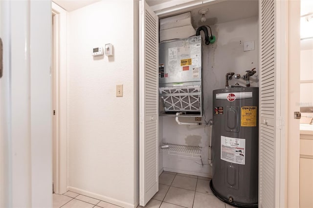 3256 White Ibis Ct Unit 24A, Punta Gorda, FL 33950 - utility room featuring electric water heater