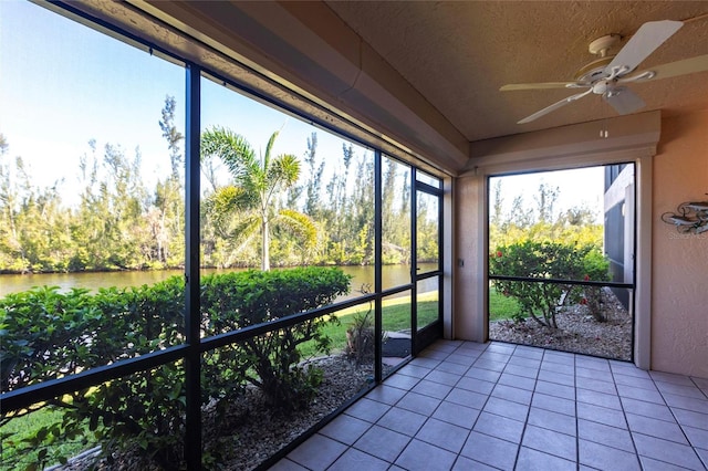3256 White Ibis Ct Unit 24A, Punta Gorda, FL 33950 - unfurnished sunroom with a water view, a ceiling fan, and plenty of natural light