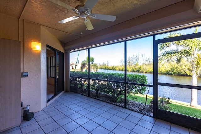 3256 White Ibis Ct Unit 24A, Punta Gorda, FL 33950 - unfurnished sunroom featuring a water view and a ceiling fan