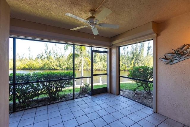 3256 White Ibis Ct Unit 24A, Punta Gorda, FL 33950 - unfurnished sunroom featuring a water view, a ceiling fan, and healthy amount of natural light