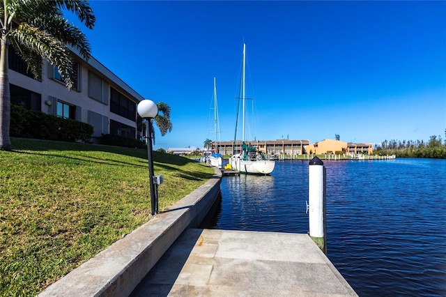 3256 White Ibis Ct Unit 24A, Punta Gorda, FL 33950 - dock area featuring a water view and a lawn