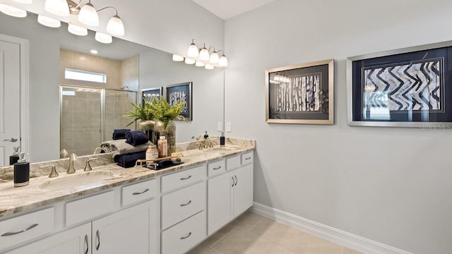 15968 Crofton Springs Way, Port Charlotte, FL 33953 - full bath with a stall shower, baseboards, double vanity, and tile patterned flooring