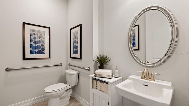 15968 Crofton Springs Way, Port Charlotte, FL 33953 - bathroom featuring a sink, baseboards, and toilet