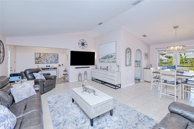 25379 Paladin Ln, Punta Gorda, FL 33983 - living room featuring vaulted ceiling, light tile patterned floors, a chandelier, and baseboards