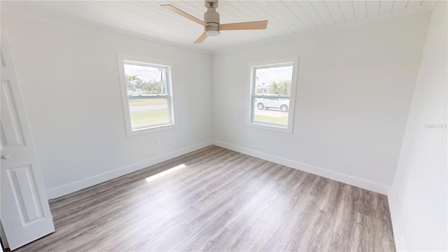 2805 Gussie St, Punta Gorda, FL 33950 - empty room featuring plenty of natural light, wood finished floors, a ceiling fan, baseboards, and wooden ceiling