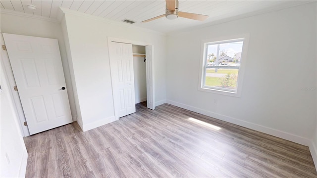 2805 Gussie St, Punta Gorda, FL 33950 - unfurnished bedroom with ornamental molding, light wood-style floors, baseboards, and a closet