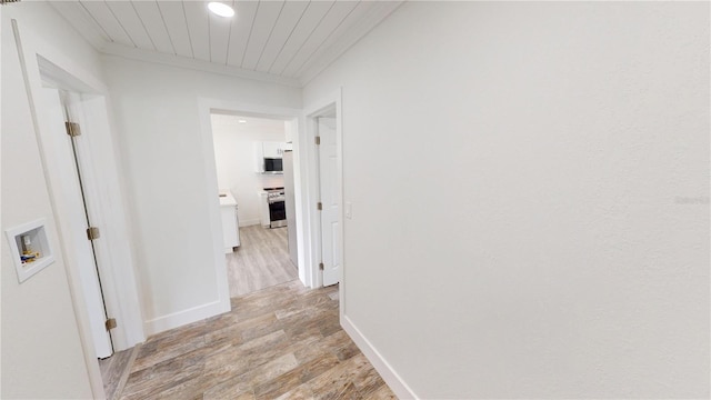 2805 Gussie St, Punta Gorda, FL 33950 - hallway featuring light wood-type flooring, baseboards, and crown molding