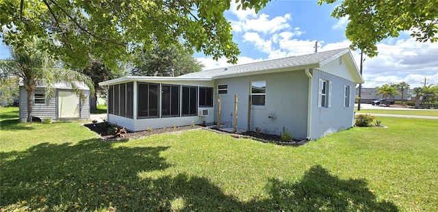 2805 Gussie St, Punta Gorda, FL 33950 - back of house with a sunroom, a lawn, and stucco siding