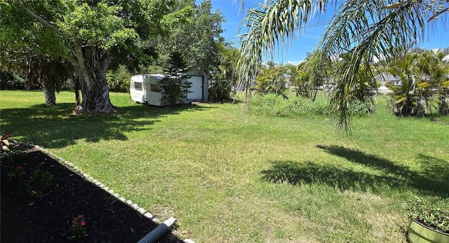 2805 Gussie St, Punta Gorda, FL 33950 - view of grassy yard featuring an outdoor structure