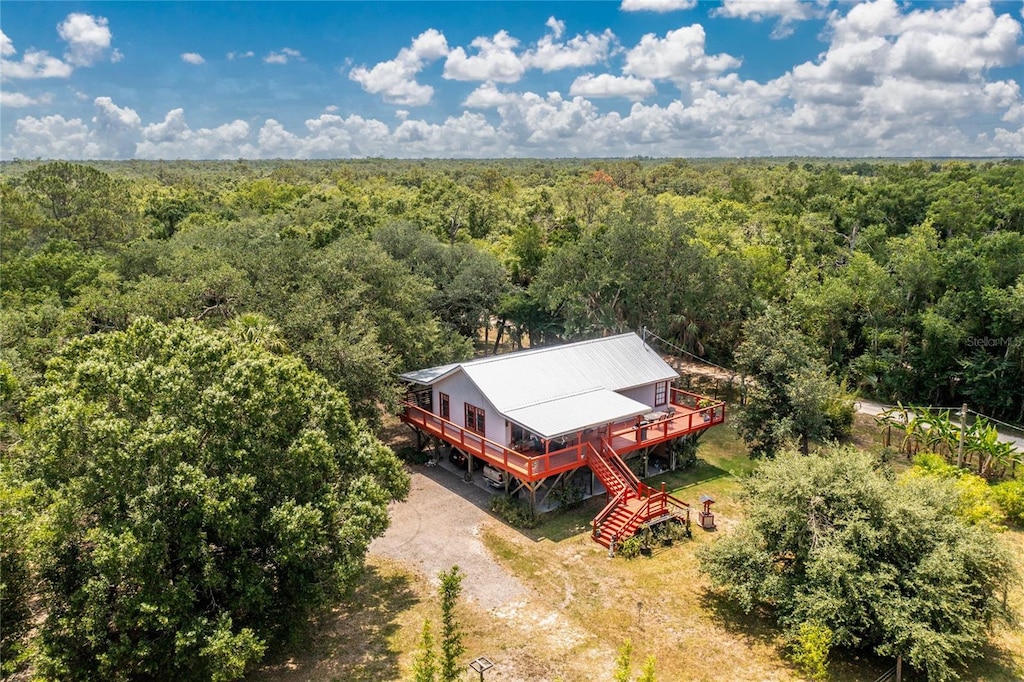 2230 SW Nassau Ave, Arcadia, FL 34266 - aerial view of property and surrounding area with a heavily wooded area