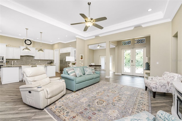 1025 Cheshire St, Port Charlotte, FL 33953 - living area featuring ceiling fan, recessed lighting, french doors, wood finished floors, and a raised ceiling