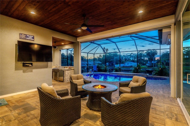 1025 Cheshire St, Port Charlotte, FL 33953 - view of patio / terrace with area for grilling, ceiling fan, an outdoor fire pit, an outdoor pool, and a lanai