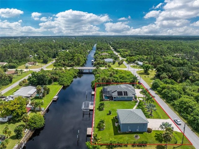 1025 Cheshire St, Port Charlotte, FL 33953 - aerial view of residential area with a large body of water and a forest