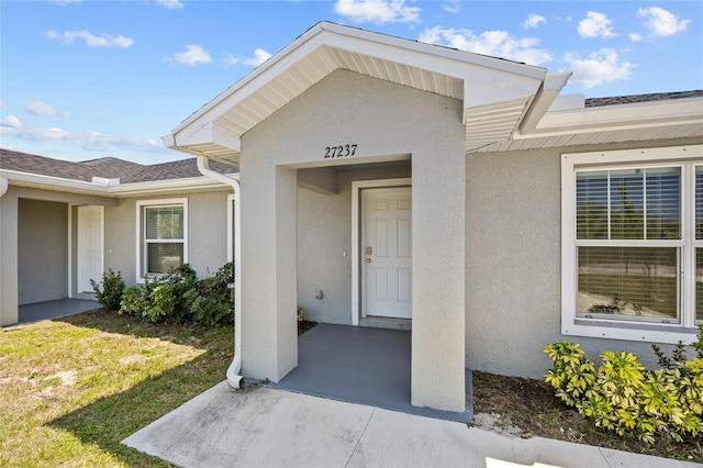 27237 Partin Dr, Punta Gorda, FL 33983 - property entrance featuring stucco siding