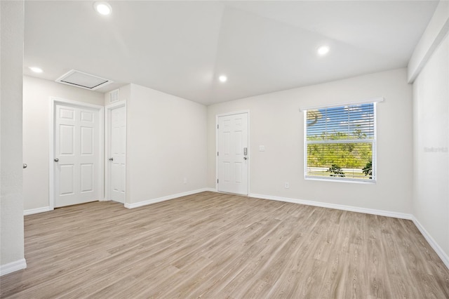 27237 Partin Dr, Punta Gorda, FL 33983 - unfurnished room featuring attic access, light wood-style floors, baseboards, recessed lighting, and vaulted ceiling