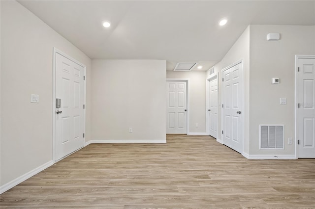 27237 Partin Dr, Punta Gorda, FL 33983 - empty room featuring light wood-type flooring, baseboards, attic access, and recessed lighting