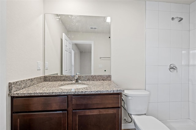 27237 Partin Dr, Punta Gorda, FL 33983 - full bath featuring a tile shower, vanity, and toilet